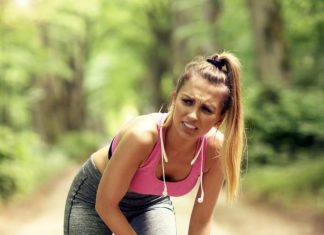 female runner suffering from knee pain