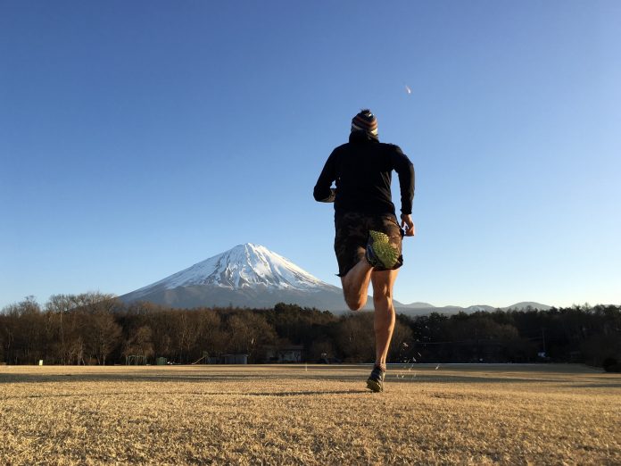 runner trying to run up a mountain