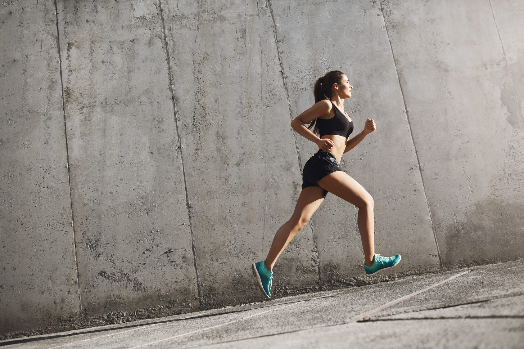 female running doing running strides